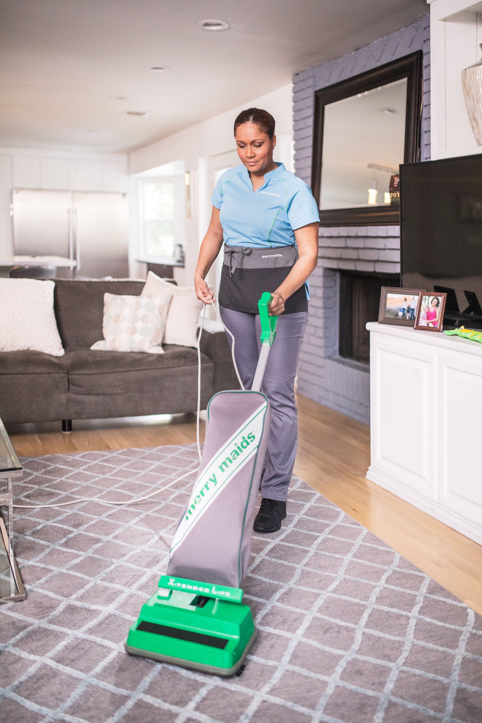 Merry Maids of Rochester team member vacuuming during housekeeping services