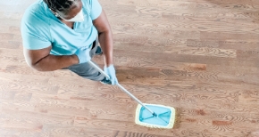 Merry Maids House Cleaners cleaning floor during house cleaning service