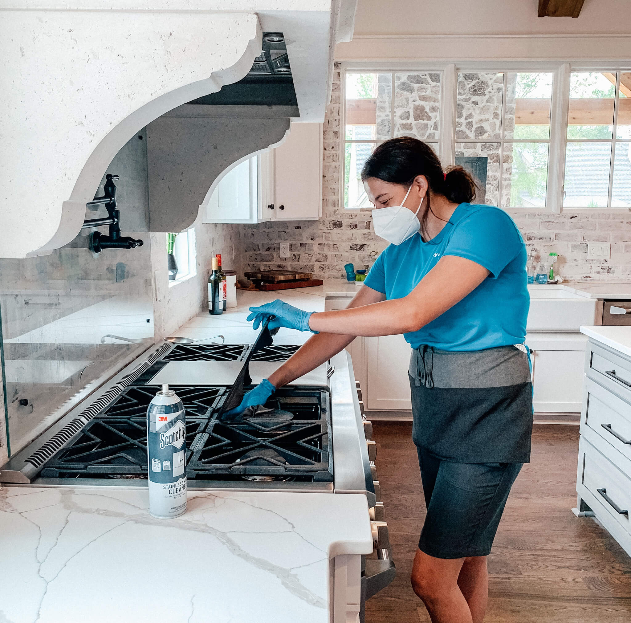San Antonio housekeeper cleaning stovetop 